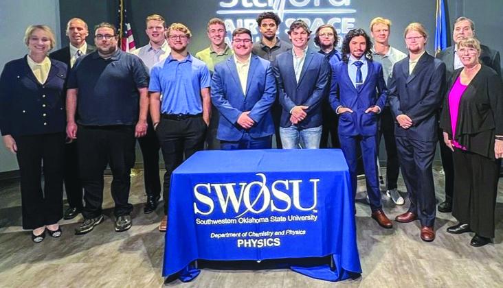 Pictured, front row from left, are SWOSU President Dr. Diana Lovell, Clinton Lloyd, Austin Jones, Christopher Svebek, Cody Conrady, Andres Arrieta, Isaac Martyn and Dr. Terry Goforth. Back row are Dr. Wayne Trail, Ethan Layman, Mason Hart, Benjamin Smith, Gunner Snowden, Geoffrey Marlow and Dr. Tony Stein.